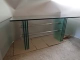 a glass table with a mirror on top of it