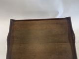 an antique wooden tray with handles and handles on a white background