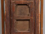 an old wooden easel with a picture frame on top of it