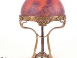 a lamp that is sitting on a table with a cord