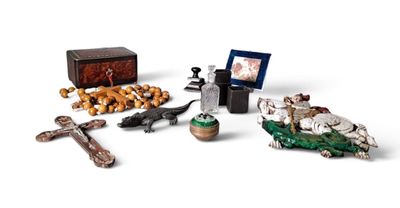 a small assortment of religious items on a white surface