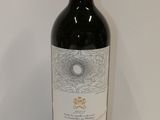a bottle of wine that is sitting on a table