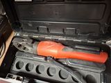 a tool in a tool box with a wrench