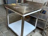 a table that is sitting on a cart on the floor