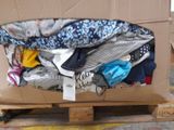 a box full of clothes on a pallet in a warehouse