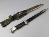 two knives that are sitting next to each other on a table