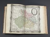 an open book with a map of the country of england