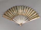 a fan that is hanging on the wall in the room