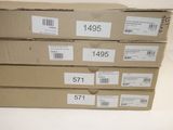 three boxes with labels on them are stacked on top of each other