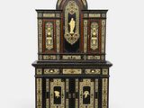 a black and gold cabinet with a clock on top of it
