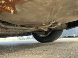 a close up of a car ' s exhaust pipe and exhaust pipe
