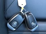 two keys attached to the back seat of a car