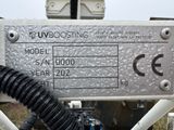 a close up of a metal sign on a pole