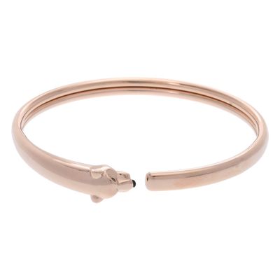 a rose gold cuff bracelet with a snake on it