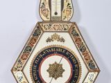 an old clock with a decorative design on the front of it