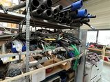 a lot of tools and tools on the shelves in the garage