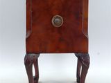a small wooden table with a drawer on top of it