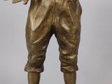 bronze statue of a man holding a fish in his hands