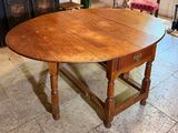 a wooden table with a wooden top in a room