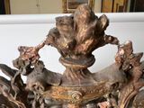 a very old looking chandelier that is on a table