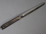 a knife that is laying on a table
