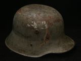 an old helmet on a black background with the word ww1 written on it