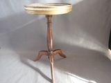 a small table with a glass top on a wooden stand