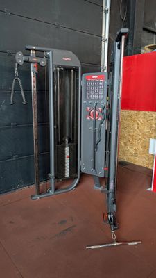 a gym equipment in the corner of a building