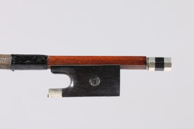 a close up of a violin bow on a white background