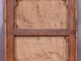 an old wooden frame with a burlock cloth covering it