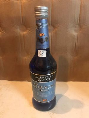 a bottle of liquor that is sitting on a table