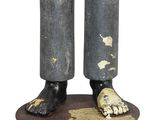 a statue of a person standing on a pedestal