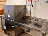 a kitchen with a sink and a stove in it