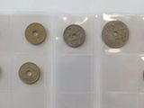 five different types of coins in a plastic case