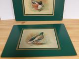 pair of two framed watercolor paintings of ducks on a table