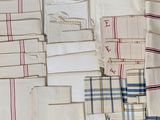 many different types of towels and napkins laid out on a table