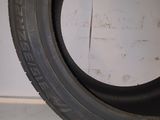 tire tread of a car on the floor in a garage