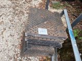 an image of a manhole with a sign on it