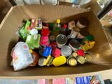 a cardboard box full of food items on a table