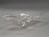 clear glass bowl on a white surface with a white background