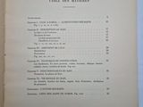 an open book with a list of items in it on a table