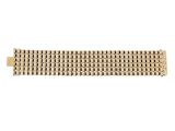 a close up of a gold bracelet on a white background
