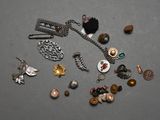 a lot of jewelry that is laying out on the table