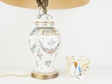 a lamp that is sitting next to a vase