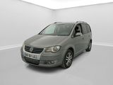 a grey van is parked in a white room with white walls