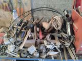 a pile of tools sitting in the back of a truck