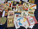 many different types of beer labels on a table