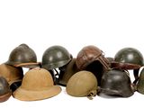 a lot of helmets that are sitting on a white surface