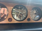 a close up of a car dashboard with various gauges