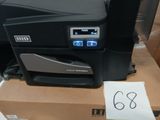 a black printer sitting on top of a cardboard box